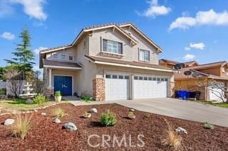 view of front of property featuring driveway and an attached garage