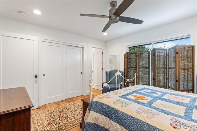 bedroom featuring a ceiling fan, light wood-type flooring, and recessed lighting