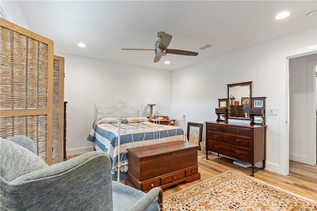 bedroom featuring light wood-style floors, baseboards, visible vents, and recessed lighting