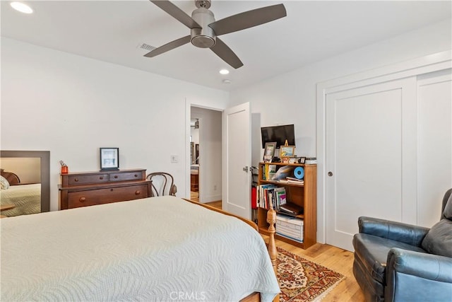 bedroom featuring light wood finished floors, visible vents, a ceiling fan, a closet, and recessed lighting