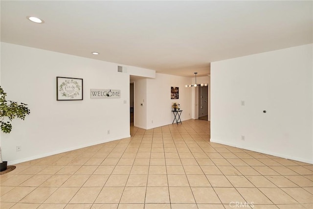 spare room with baseboards, light tile patterned floors, visible vents, and recessed lighting