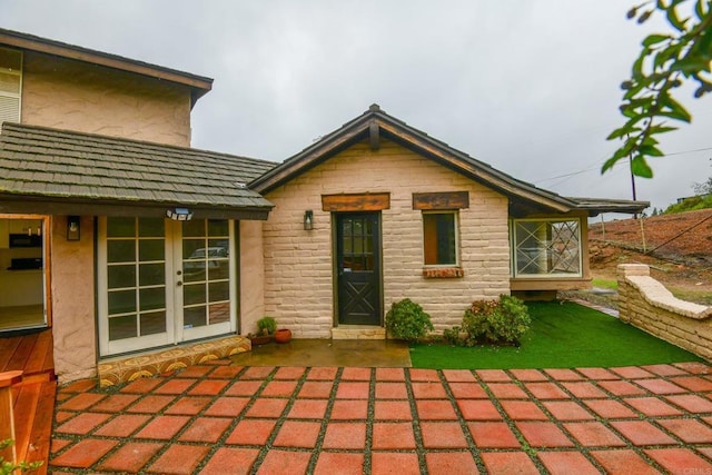 back of house featuring french doors and a patio