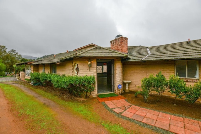 view of front of property featuring a chimney