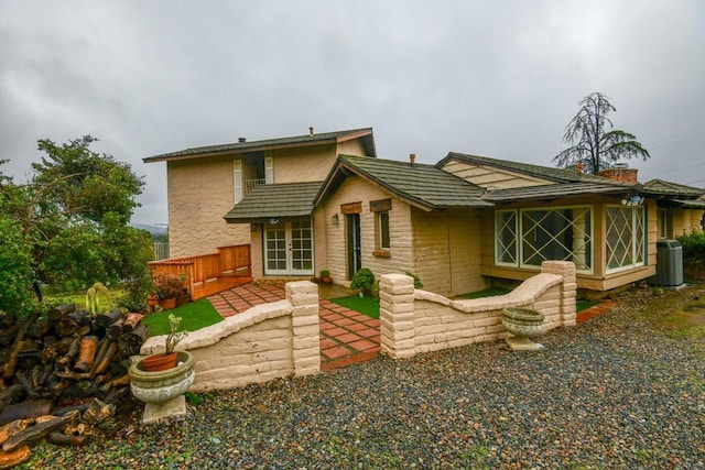 back of house with a patio, french doors, and cooling unit