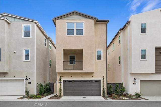 view of front of house featuring an attached garage and stucco siding