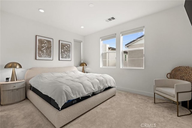 carpeted bedroom featuring recessed lighting, visible vents, and baseboards