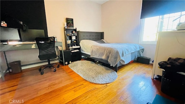 bedroom with wood finished floors