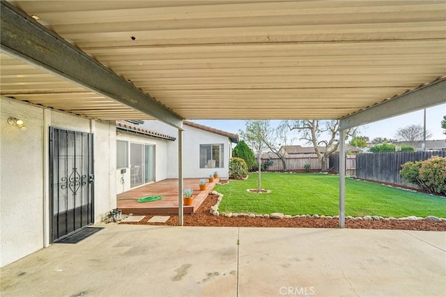 view of patio featuring fence