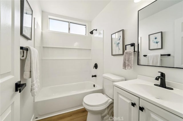 full bathroom featuring vanity, wood finished floors, shower / tub combination, and toilet