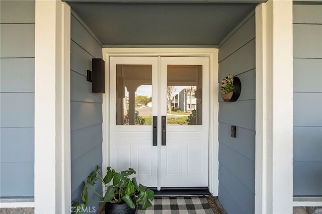 view of exterior entry featuring french doors