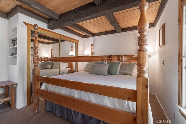 bedroom featuring carpet floors, beamed ceiling, wooden ceiling, and baseboards