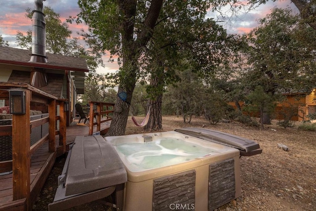 exterior space with a deck and a hot tub