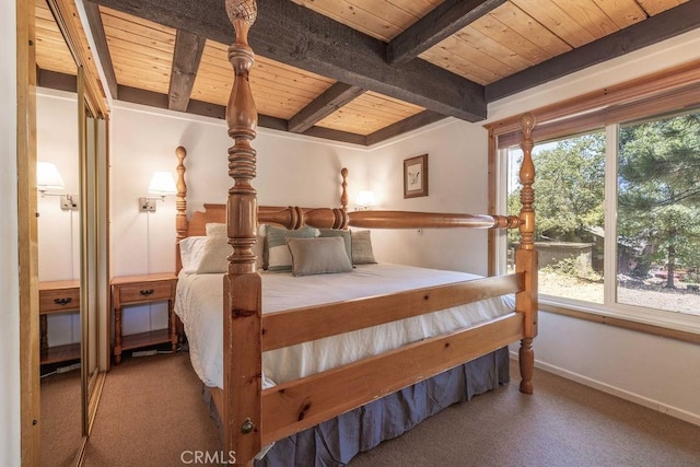 bedroom with wooden ceiling, multiple windows, beam ceiling, and carpet flooring