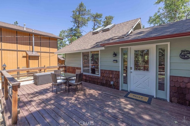 wooden deck with outdoor dining space