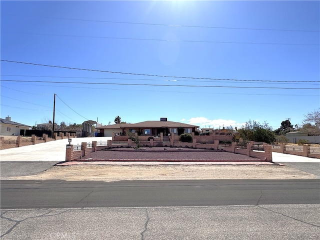 view of front of home featuring fence