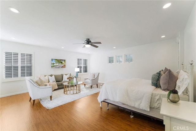 bedroom featuring recessed lighting, baseboards, wood finished floors, and ceiling fan