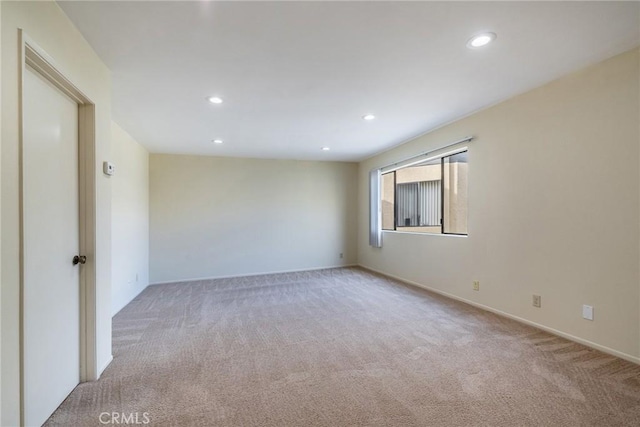 spare room featuring carpet flooring and recessed lighting