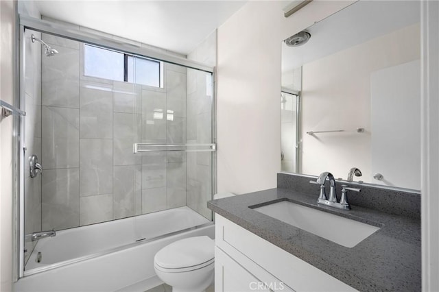 full bath with toilet, combined bath / shower with glass door, and vanity