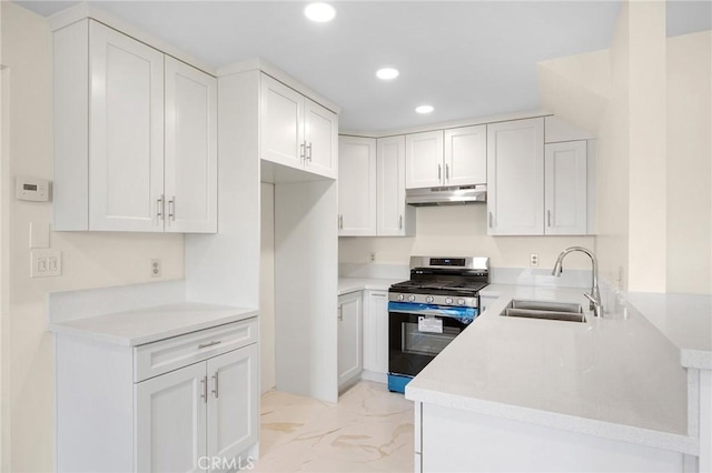 kitchen with marble finish floor, gas stove, a sink, a peninsula, and under cabinet range hood