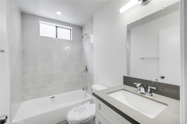 bathroom featuring shower / washtub combination, vanity, and toilet