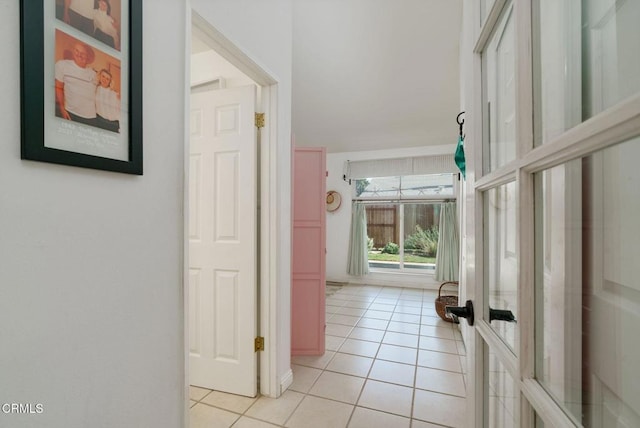 hallway with light tile patterned flooring