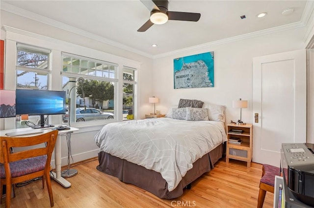 bedroom featuring ornamental molding, recessed lighting, light wood-style flooring, and a ceiling fan