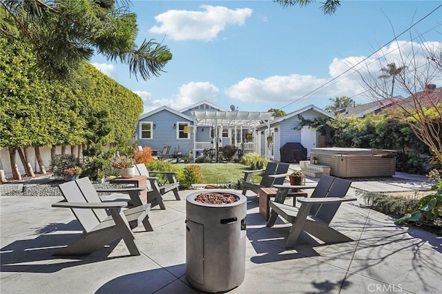 view of patio featuring a hot tub, a fire pit, a grill, fence, and a pergola