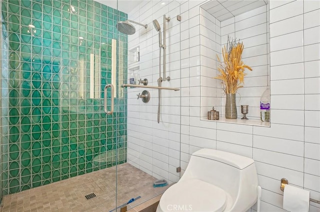 bathroom with a stall shower and toilet