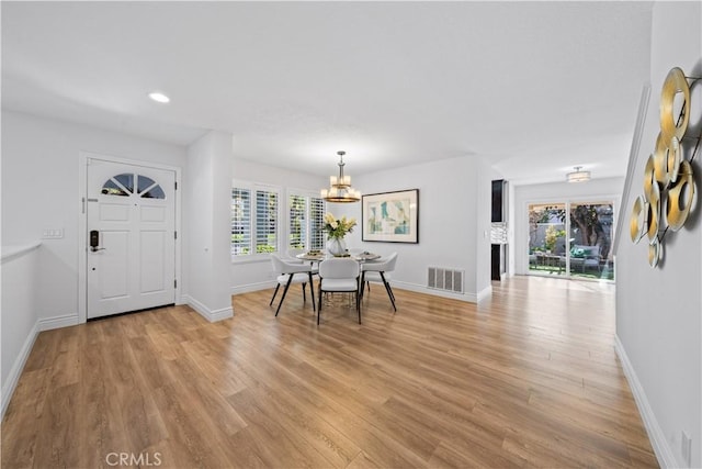 entryway with baseboards, recessed lighting, visible vents, and light wood-style floors