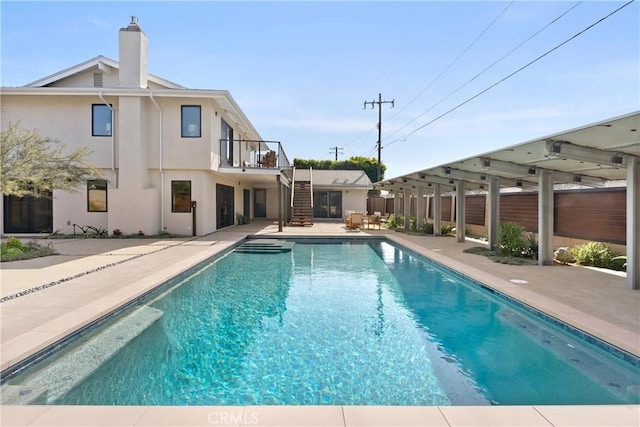 view of swimming pool featuring a fenced in pool, a patio, stairway, and fence