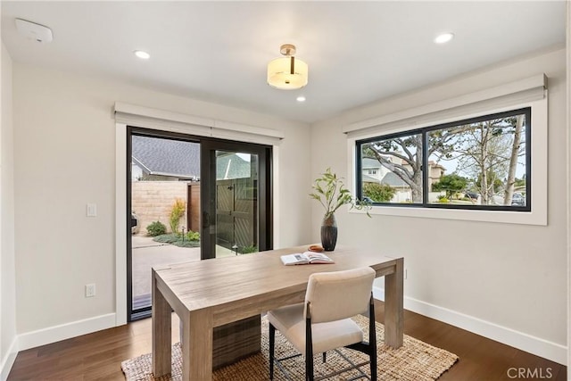 interior space featuring recessed lighting, dark wood finished floors, and baseboards