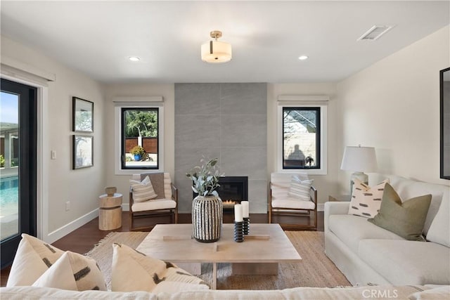 2885 Europa Dr, Costa Mesa, CA 92626 - living room with visible vents, plenty of natural light, baseboards, and wood finished floors