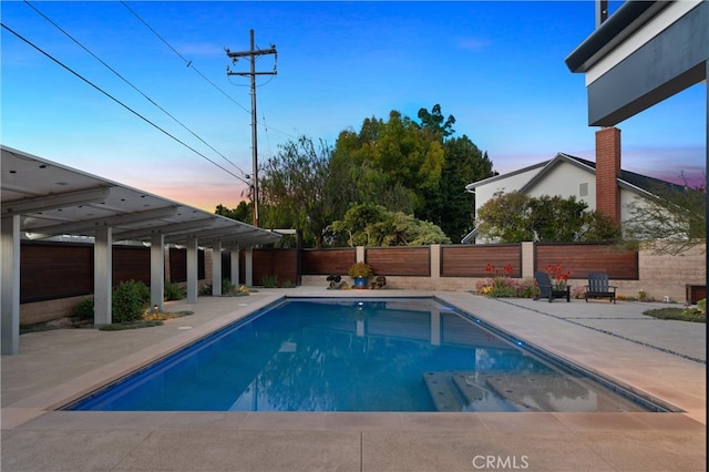 view of swimming pool featuring a fenced in pool, a fenced backyard, and a patio