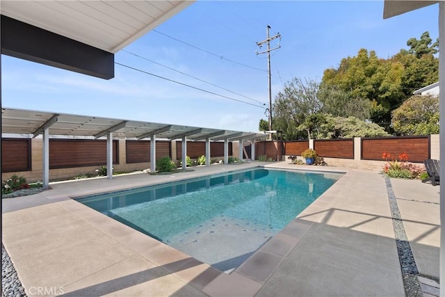 view of pool featuring a fenced in pool, a patio area, and a fenced backyard