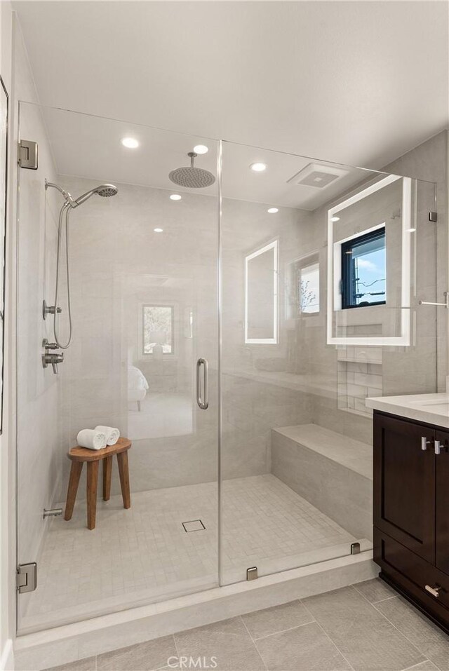 2885 Europa Dr, Costa Mesa, CA 92626 - bathroom featuring vanity, a shower stall, and tile patterned floors