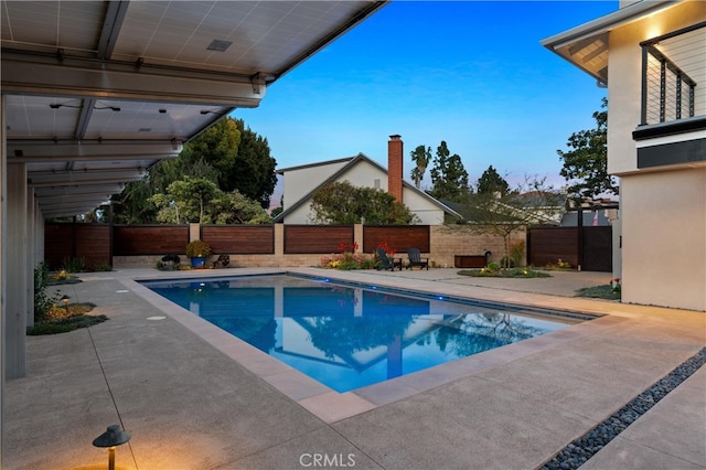 view of pool featuring a fenced backyard, a fenced in pool, and a patio