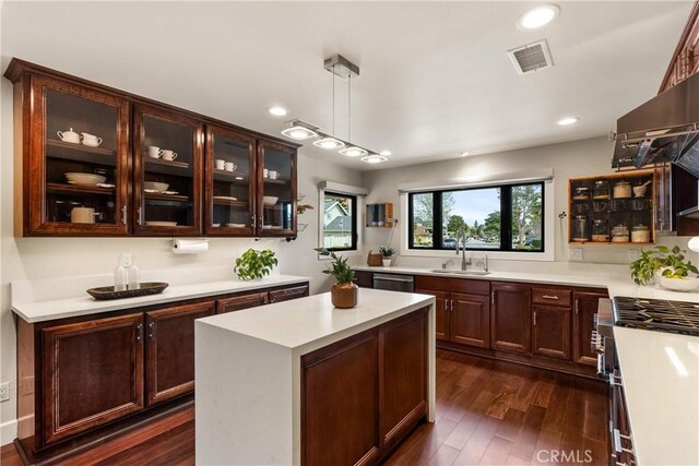 2885 Europa Dr, Costa Mesa, CA 92626 - kitchen with visible vents, appliances with stainless steel finishes, light countertops, and a sink
