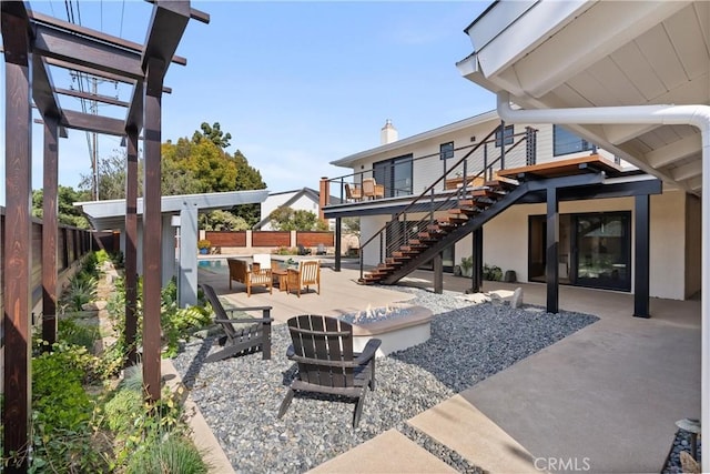 view of patio / terrace featuring stairway, a fenced backyard, and a fenced in pool