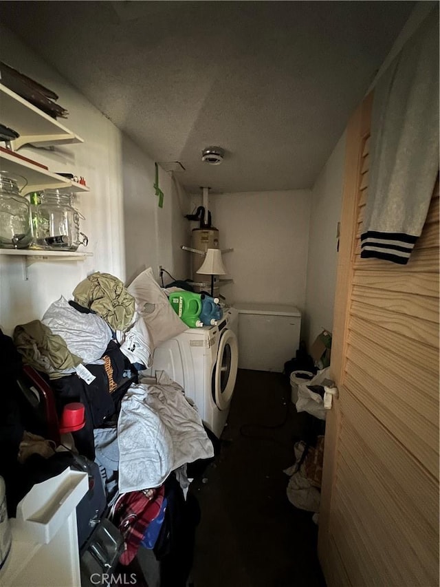 clothes washing area with water heater, laundry area, a garage, and washer and dryer