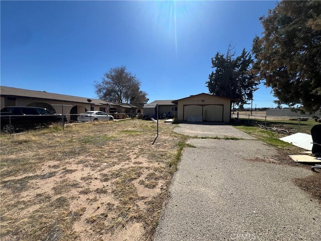 exterior space with fence and an outbuilding