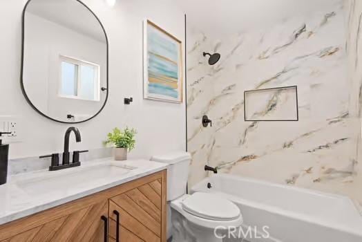 full bathroom featuring shower / bath combination, vanity, and toilet