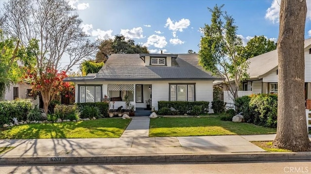 bungalow with a front yard