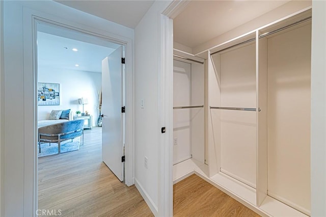 walk in closet featuring light wood-type flooring