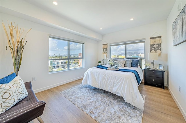 bedroom featuring recessed lighting, light wood-style flooring, and baseboards