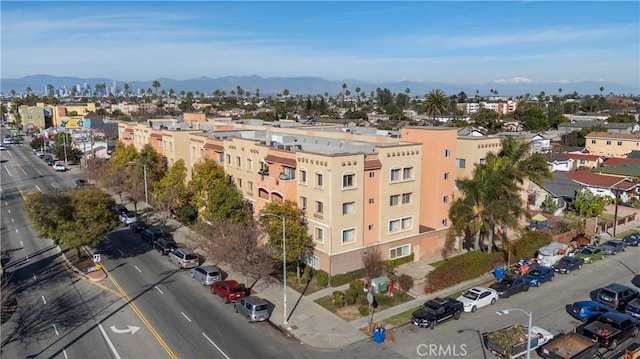 birds eye view of property featuring a mountain view