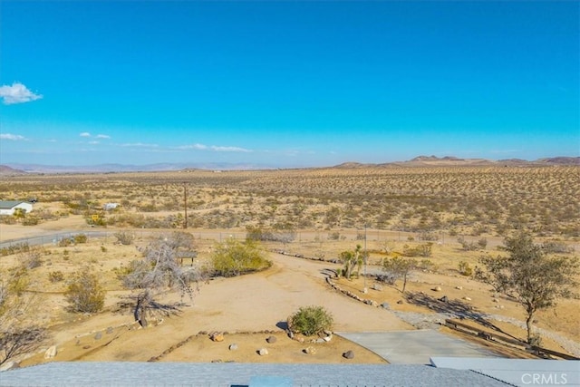 view of mountain feature with a desert view and a rural view