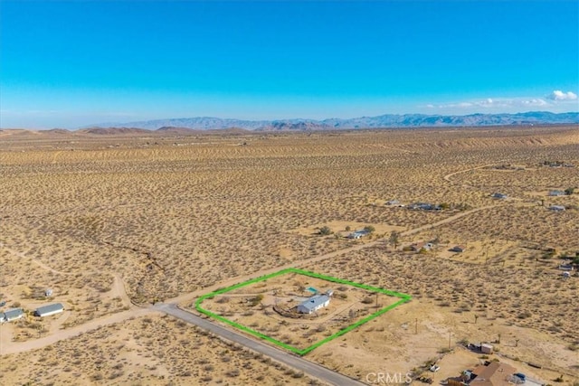 bird's eye view featuring view of desert, a rural view, and a mountain view