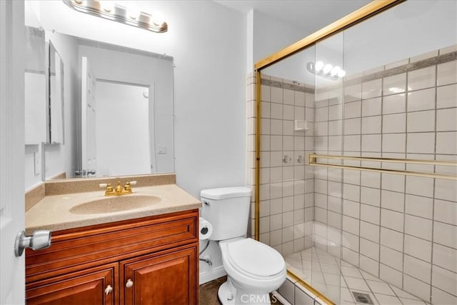 full bathroom featuring toilet, a shower stall, and vanity