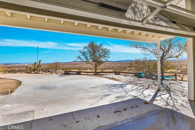 view of patio / terrace featuring a mountain view