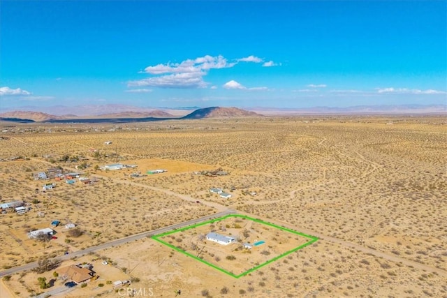 birds eye view of property with a rural view, a desert view, and a mountain view